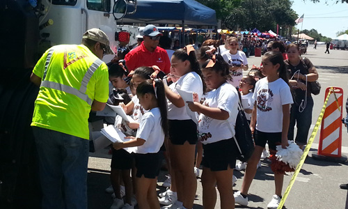 Image of Waste Connections employees interacting with community.